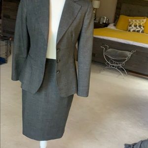 Three piece wool-style suit in universal charcoal